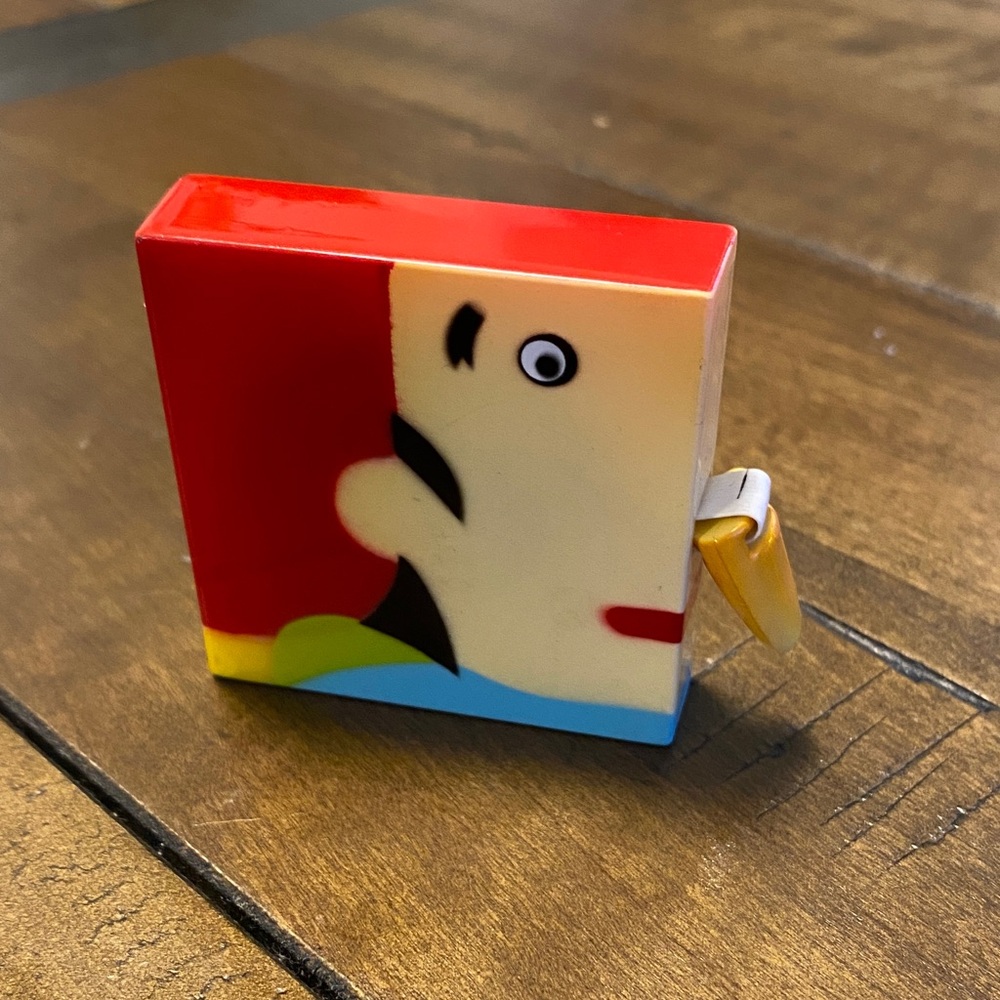 Vintage growing nose square measuring tape